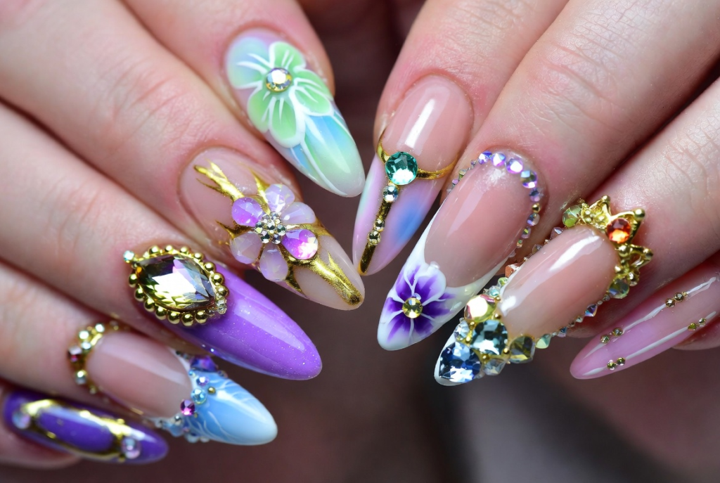 Beauty and the Beast nail ideas 2026 featuring dramatic coffin-shaped acrylic nails with intricate 3D enchanted rose designs in deep red and gold on a dark background with green leaves and stems